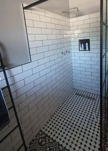 Client bathroom using our essence white gloss ceramic wall tiles