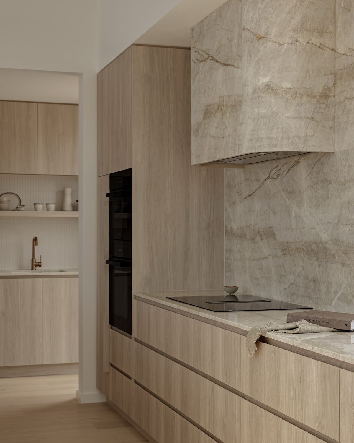 timeless kitchen colour palettes: kitchen featuring neutral cabinetry with beige marble tiles